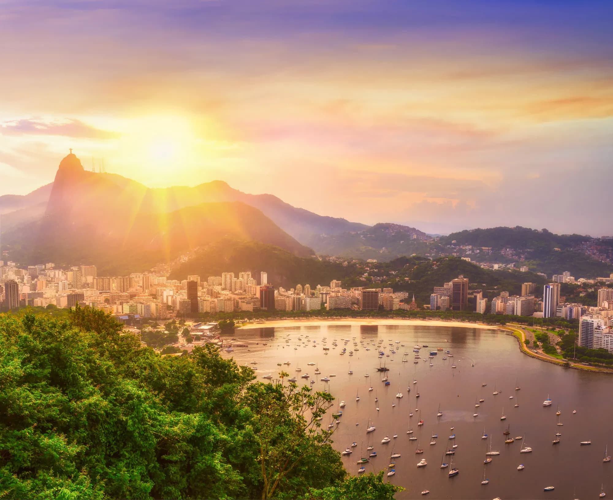 Christ the Redeemer on Corcovado above Botafogo Bay at sunset, Rio de Janeiro, Brazil